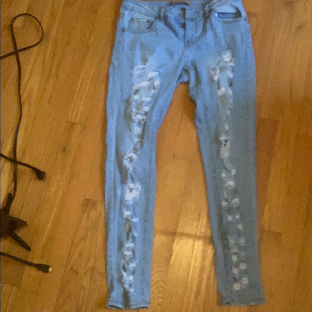 Woman’s ripped jeans